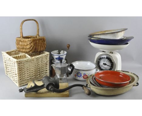 A group of enamel kitchen ware and a coffee grinder