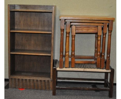 An oak four shelf bookcase, 89cm high x 46cm wide x 19cm deep, with a nest of tables, a stool