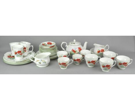 A Duchess 'Poppies' tea set to include teapot, creamer, plates cups and saucers. Teapot measures; 14cm tall.