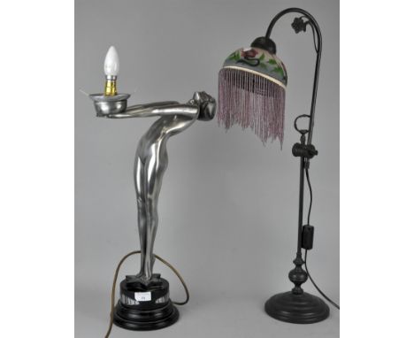 An Art Deco style figural lamp and an Art Nouveau style lamp with glass shade. Tallest measures; 76cm high.