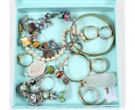 A collection of jewellery including Pandora style bracelets and a carved jade pendant