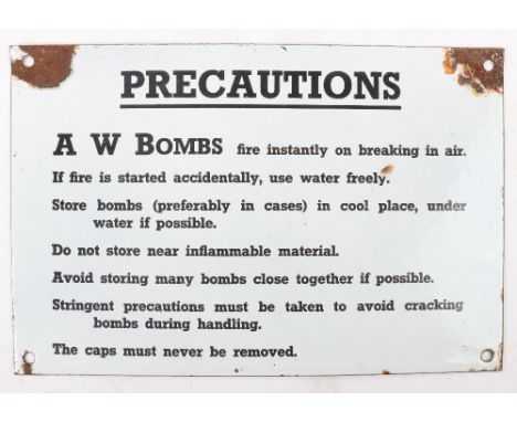 WW2 Precautions A W BOMBS enamel sign: Enamel sign with details to front some damage to hole fixing areas, size 31 cms x 20.5