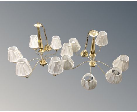 A pair of contemporary brass six way light fittings, with shades.