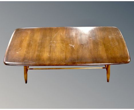 An Ercol stained elm and beech coffee table with undershelf