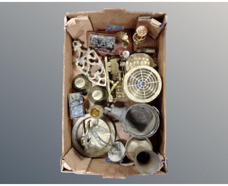 A box containing copper and brass wares including a miniature miner's lamp, mining figures, trivet, hand bells etc.