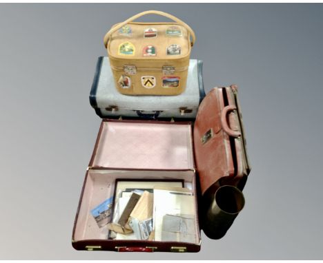 A brass ammunition shell together with four vintage cases, one containing paper ephemera, military ephemera etc
