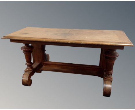 A mahogany and walnut low console table with mirrored back.