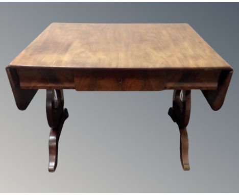 A 19th century mahogany flap sided sofa table fitted with a drawer.