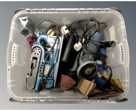 A box containing power tools including Makita belt sander, Bosch angle grinder, Black and Decker jig saw etc.