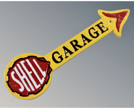 A cast iron Shell garage arrow wall plaque.