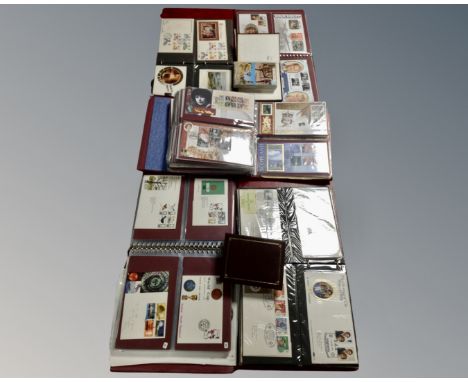 A box containing five albums of First Day Covers together with two further albums of postcards and two further empty albums. 