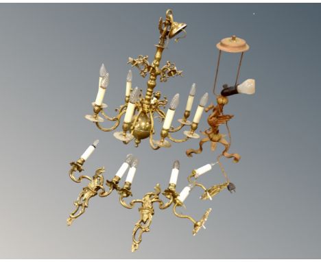 A continental brass eight way light fitting together with a further gilt metal table lamp and two pairs of gilt metal wall li