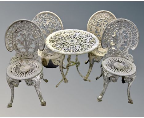 A painted cast metal circular patio table together with four chairs  CONDITION REPORT: Table width 64 cm, height 63 cm. The p