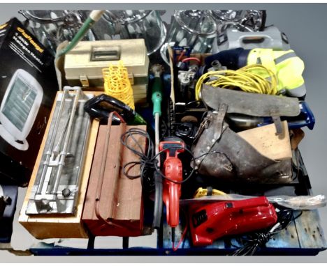 A pallet containing toolboxes, tilecutter, power tool cases, 110v extension lead, foot pump, sander, electric hedge trimmer e