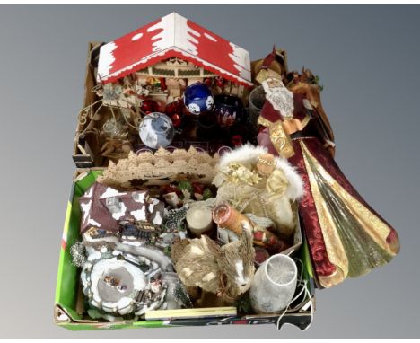 Two boxes containing Christmas ornaments and decorations including tea light holders, tree topper, glass lamp etc.