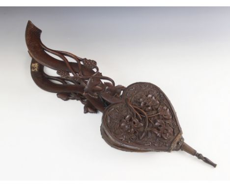 A set of 19th century carved walnut bellows, possibly French, the curved scale effect handles extending to the heart shaped b