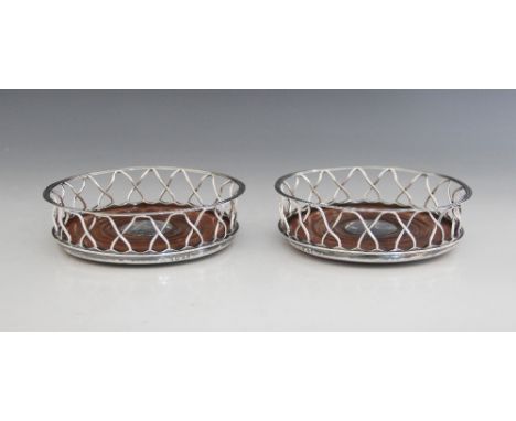 A pair of George III silver mounted bottle coasters, William Allen III, London 1802, each of circular form with turned circul