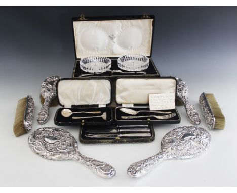 A Victorian silver mounted dressing table set, John Round &amp; Son Ltd, Sheffield 1899,&nbsp; comprising a handheld mirror, 