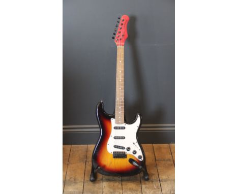 A Stagg Stratocaster copy electric guitar, with sunburst body, rosewood neck and later painted headstock, complete with canva