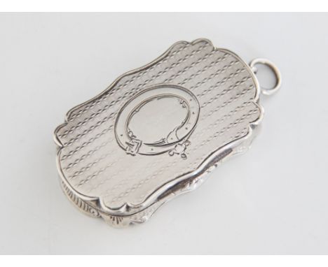A Victorian silver vinaigrette, Charles Washington Shirley Deakin, Birmingham 1856, of oval shaped form, engine turned decora