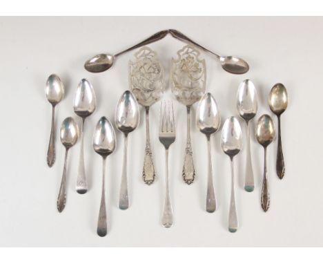 A pair of continental silver fish servers, the shaped blades with pierced floral decoration, monogrammed initials to terminal