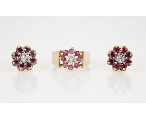 A ruby and diamond 9ct gold cluster ring, designed as a central round brilliant cut diamond illusion set to a surround of mix