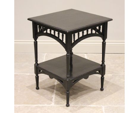 An Arts & Crafts ebonised occasional table, in the manner of E.W Godwin, circa 1900, the square moulded top above a curved sp