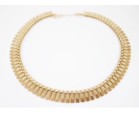 A 9ct gold fringe collarette, each tapered link with textured engine turned detail, spring ring and loop fastening with attac