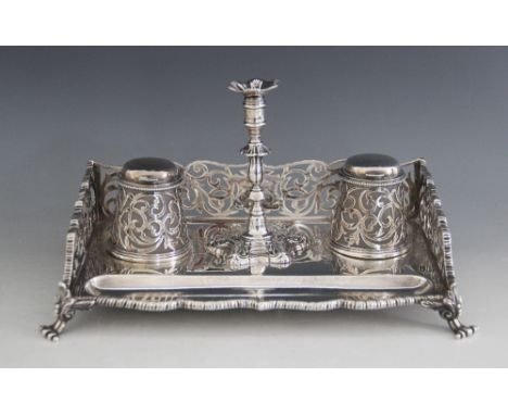 A Victorian silver desk stand, Barnard & Sons Ltd, London 1873, the rectangular base raised on four acanthus capped scroll fe