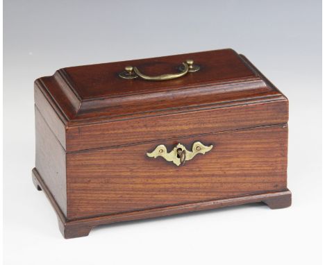 A George III mahogany tea caddy, of rectangular form, the moulded hinged cover applied with a brass swing handle, opening to 