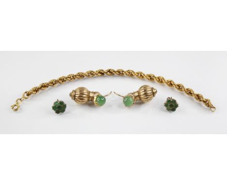 A pair of gold coloured earring droppers, each of reeded spherical form set with an emerald coloured cabochons, 23.2mm long, 