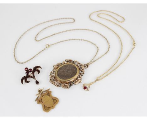A gold coloured ruby set drop pendant, the round mixed cut (untested) ruby measuring 4mm diameter, claw set to a pierced scro