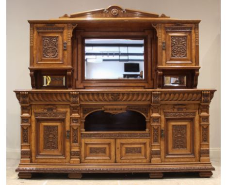 A late Victorian oak and pollard oak mirror back sideboard, by Ashton, Leach, and Cumberbirch, Rochdale, the architectural mi