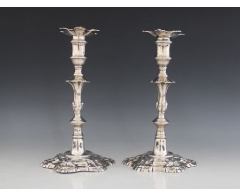 A pair of George III silver candlesticks, John Hyatt & Charles Semore, London 1760, each with knopped step on hexafoil foot w