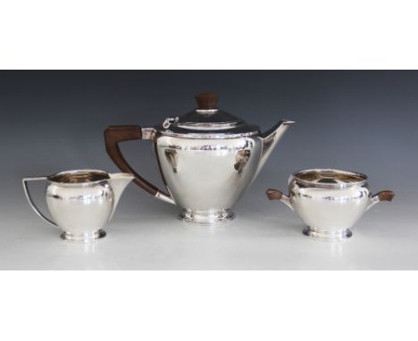 An Art Deco silver tea service, Henry Clifford Davis, Birmingham 1932, comprising teapot, milk jug and sucrier, each piece of