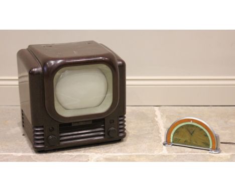 A 1950's Bush Type 22 Bakelite television, with a 23cm wide screen above a moulded grille, 37cm high, along with a Smiths Art