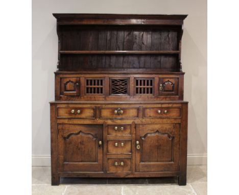 A mid 18th century oak tridarn, of pegged construction, the superstructure canopy with a moulded cornice over a single shelf,