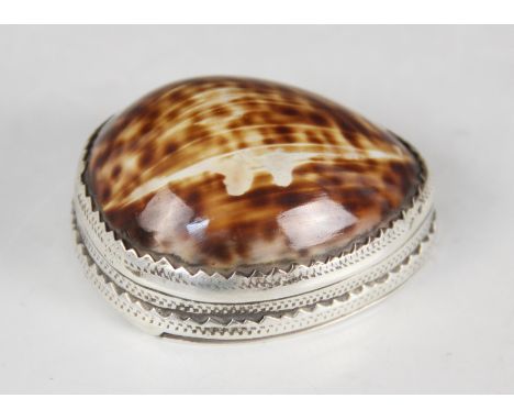 An 18th century cowrie shell snuff box, the silver coloured mounts with punched dot detail, hinged cover, 6cm long (at fault)