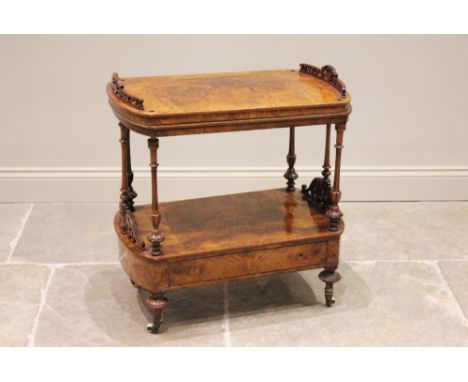 A Victorian burr walnut étagère, on slender fluted supports with a drawer to the lower tier, raised upon ceramic castors, inc