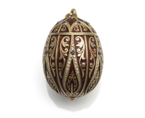 Osterei-Anhänger mit Brillanten und SaphirenL 5,4 cm750/000 Gelbgold mit Sicherheitskettchen und rot-brauner Emaile. 86 Brill