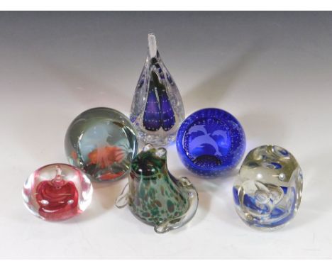PAPERWEIGHTS. Six various glass paperweights including two by Caithness Glass. Also, a Langham glass frog paperweight, a Sara