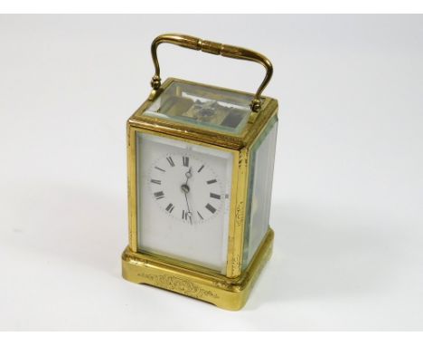 CARRIAGE CLOCK. A Japy Freres brass case, carriage clock with engraving, white enamelled dial & movement No. 2836, striking o