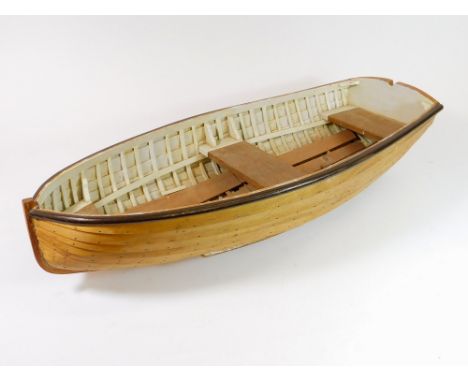 CLINKER BOAT MODEL. A 20th century oak & pine clinker-built model of a rowing boat, the interior partly-painted. Length 67cm.