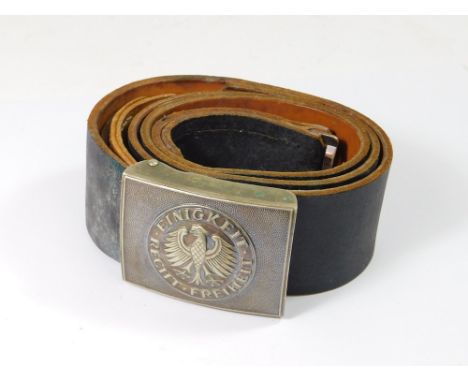 GERMAN BELT. A post-WWII West German Army leather belt, the buckle with the national anthem.  Please note that all items in t