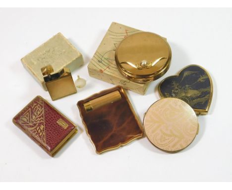 COMPACTS ETC. A Swiss musical compact in gold tone & pearl playing 'Auf Wiedersehen'. Also, three other compacts including St