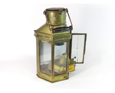 SHIP'S LAMP. A brass ship's lamp with glazing to three sides, the burner stamped Eli Griffiths & Sons 1915. Height including 