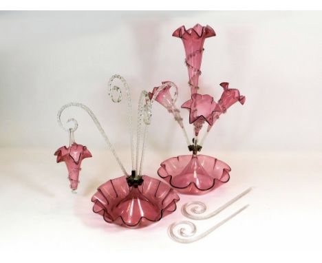CRANBERRY EPERGNE ETC. A large Victorian cranberry glass epergne with four frilled trumpets. Max. height 56cm. Also, one othe