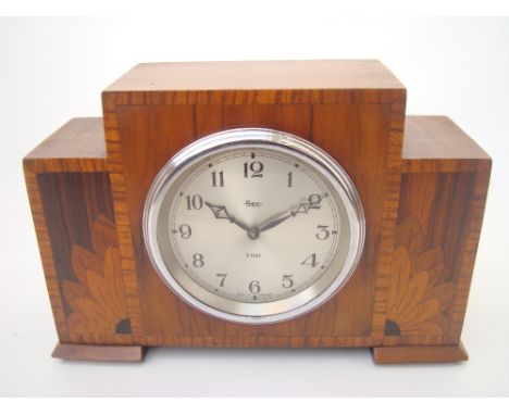 A 1930's walnut and marquetry cased eight day sec mantle clock. 