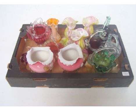A collection of Victorian and later glass baskets and vases, some end of day, others cranberry together with a murano candles