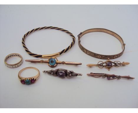 A small quantity of jewellery to include: A late Victorian amethyst and pearl 15ct bar brooch. A 9ct bar brooch. A ruby and t